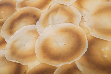 dozens of pancakes as a background, copy space