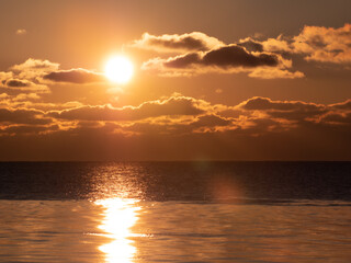 Cold winter sea shore at sunset. The sun went down