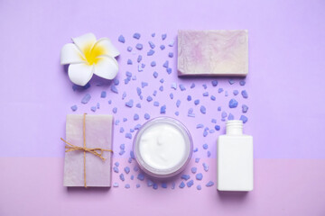 Obraz na płótnie Canvas Flat lay composition with spa items on violet background
