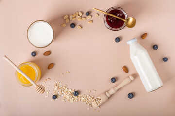 Fototapeta premium breakfast ingredients, oatmeal with berries and yoghurt