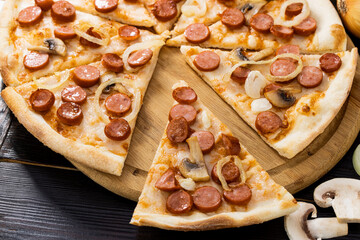pizza with mushrooms on a wooden background