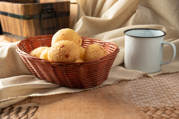 Cheese bread from Brazil, Arrangement with cheese bread, fabric and accessories on a table, selective focus.