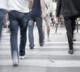 Stressful spaces, filtered blur abstract people background, unrecognizable silhouettes of people walking on a street