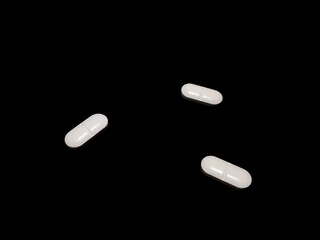 Antidepressants drug pills on black background