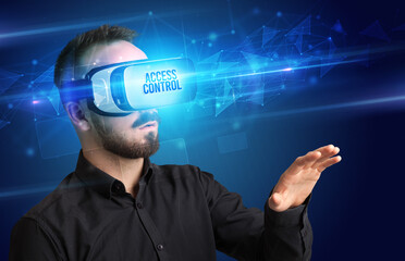 Businessman looking through Virtual Reality glasses with ACCESS CONTROL inscription, cyber security concept