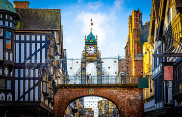 Eastgate clock of Chester, a city in northwest England,  known for its extensive Roman walls made of local red sandstone - obrazy, fototapety, plakaty