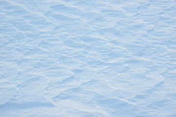 Obraz premium Fresh clean white snow background texture. Winter background with snowflakes and snow mounds. Snow lumps. Seasonal landscape details.