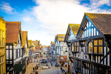 Old houses of Chester, a city in northwest England,  known for its extensive Roman walls made of local red sandstone - obrazy, fototapety, plakaty