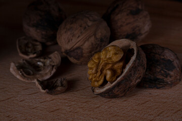 Chopped walnut on a dark background. 