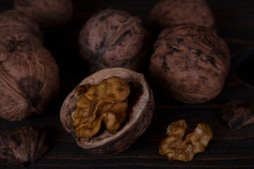 Chopped walnut on a dark background. 