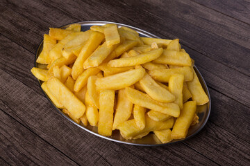 French fries on a steel tray. Served in restaurants and cafeterias. Popular food. Gourmet Photography.