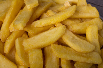 French fries close-up photograph. Gourmet potato photography.