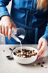 A bowl of cereal, chocolate balls.