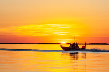 Fototapeta na wymiar Gone Fishing at Sunrise