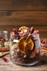 Aroma potpourri with different spices on wooden table
