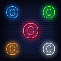 Neon letters, five colors red, blue, green, yellow, white. Isolated font on dark blue brick wall background. Vector illustration eps 10.