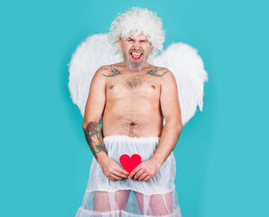 Valentines day. Man with angel wings with heart. Naughty cupid.
