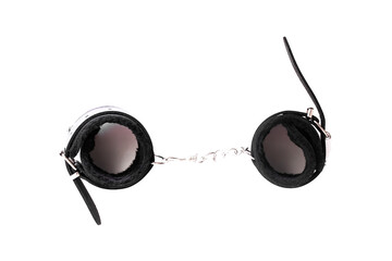 Black leather handcuffs isolated on white background