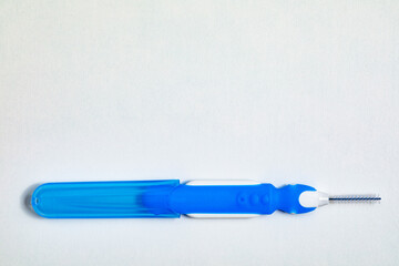 Blue with white interdental brushes. Oral hygiene. Brush your teeth thoroughly. Interdental-Sticks