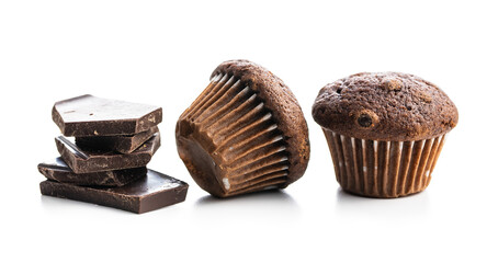 Chocolate muffins and chocolate bars. Sweet dark cupcakes