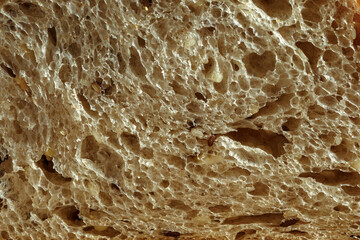 freshly baked rye bread with bran and cereal seeds: texture close-up. Healthy food.