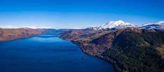 an aerial view of loch linnhe and ben nevis near fort william in winter in the argyll region of the highlands of scotland on a clear blue cold day