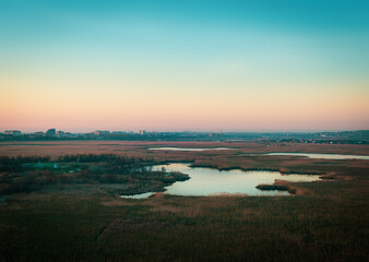 landscape with the lake and urban horizon at blue hour. Dzemete, Anapa, Russia