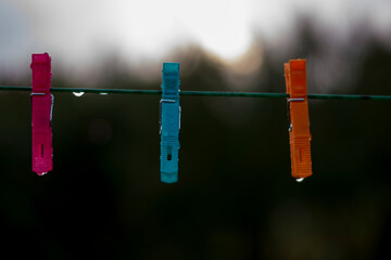 Close-up of colorful clothespins on clothesline