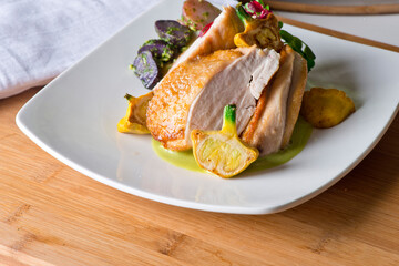 Chicken breast. Chicken pan seared to a crispy golden brown in brown butter and served with fresh organic vegetables: carrots, Brussels sprouts and green beans. Classic American restaurant favorite.