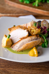 Chicken breast. Chicken pan seared to a crispy golden brown in brown butter and served with fresh organic vegetables: carrots, Brussels sprouts and green beans. Classic American restaurant favorite.