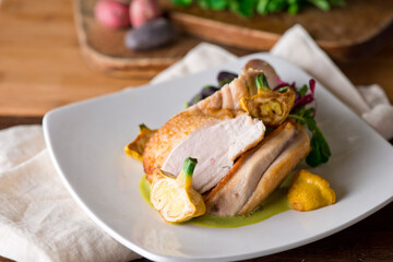 Chicken breast. Chicken pan seared to a crispy golden brown in brown butter and served with fresh organic vegetables: carrots, Brussels sprouts and green beans. Classic American restaurant favorite.