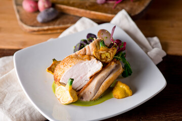 Chicken breast. Chicken pan seared to a crispy golden brown in brown butter and served with fresh organic vegetables: carrots, Brussels sprouts and green beans. Classic American restaurant favorite.