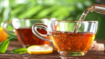 Super Slow Motion Shot of Pouring Tea. Still life Background. Filmed at 1000 fps with High Speed Cinematic Camera.