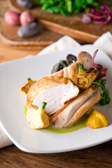 Chicken breast. Chicken pan seared to a crispy golden brown in brown butter and served with fresh organic vegetables: carrots, Brussels sprouts and green beans. Classic American restaurant favorite.