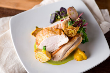 Chicken breast. Chicken pan seared to a crispy golden brown in brown butter and served with fresh organic vegetables: carrots, Brussels sprouts and green beans. Classic American restaurant favorite.