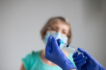 elderly woman getting coronavirus vaccine