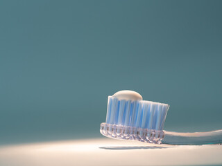 toothbrush with the right amount of toothpaste. concept of proper dental hygiene, dental care