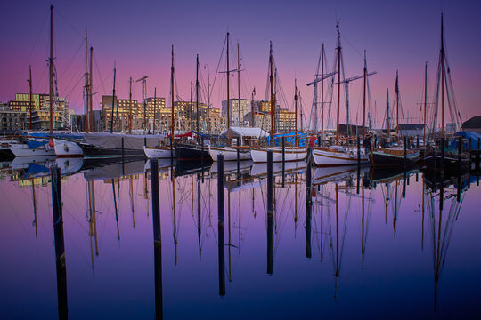 Sunset at the pier with many sailboats