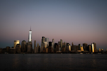 New York City Skyline at Dusk with a beautiful purple sky and warm sunset glow