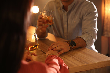 Man and woman flirting with each other in bar, closeup