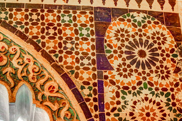 Colourful tiles and intricate plaster designs in Marrakesh Morocco