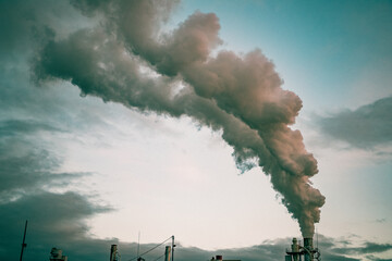 smoke coming out of factory chimney industry and global warming - Powered by Adobe