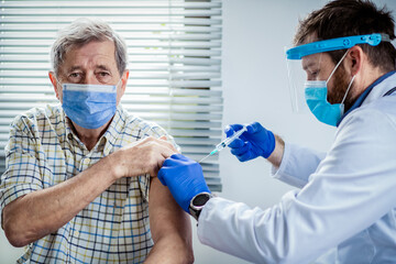 elderly man getting coronavirus vaccine
