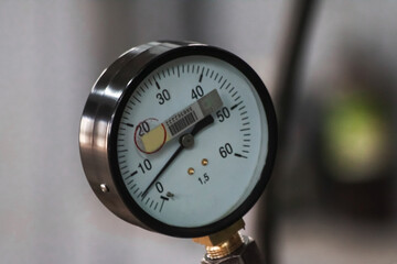 Industrial pressure gauge with dial from 0 to 60 close-up