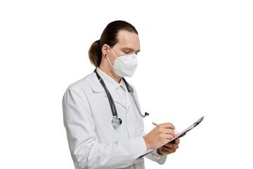 A doctor with long hair in a medical mask and dressing gown writes in a clipboard. White isolated background.