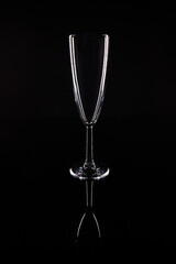 Glass of champagne on black background