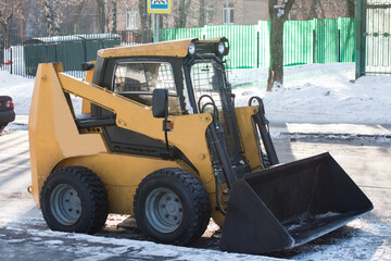 a snowplow removes snow from the roads. Public utilities