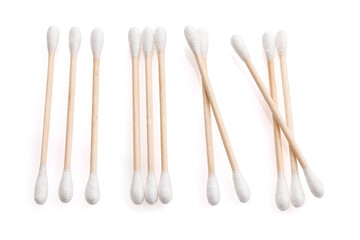 Eco-friendly materials. Wooden, cotton swabs on a white background. Close-up.