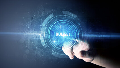 Hand touching BUDGET button, modern business technology concept