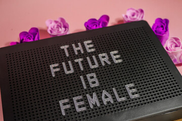The future is female slogan. Message board. Flat lay. International women day